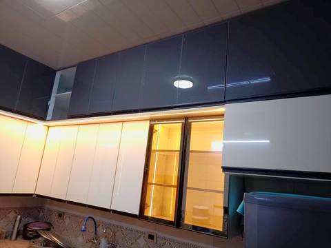 White and black gloss cabinets with hidden LED lighting