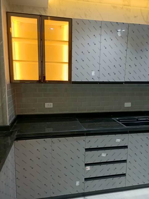 Lit glass-front wall cabinets