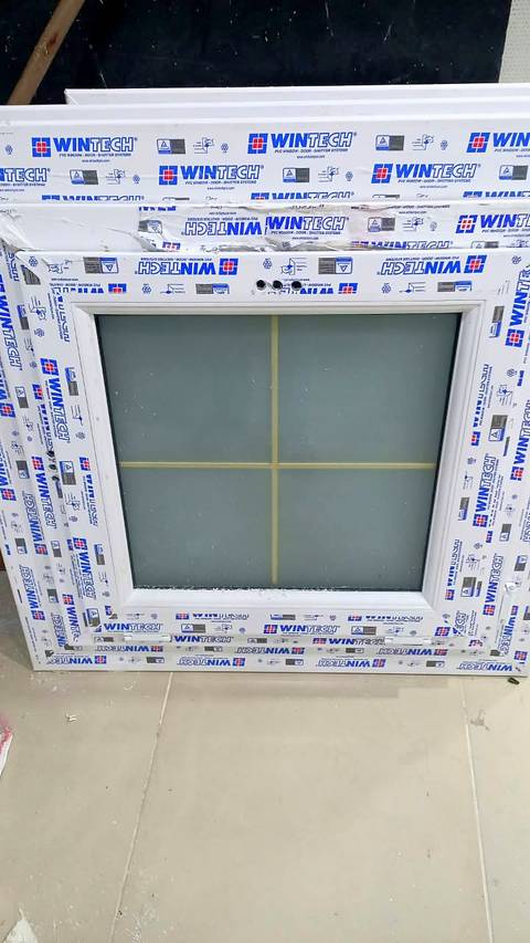 uPVC window with frosted glass and a gold grid
